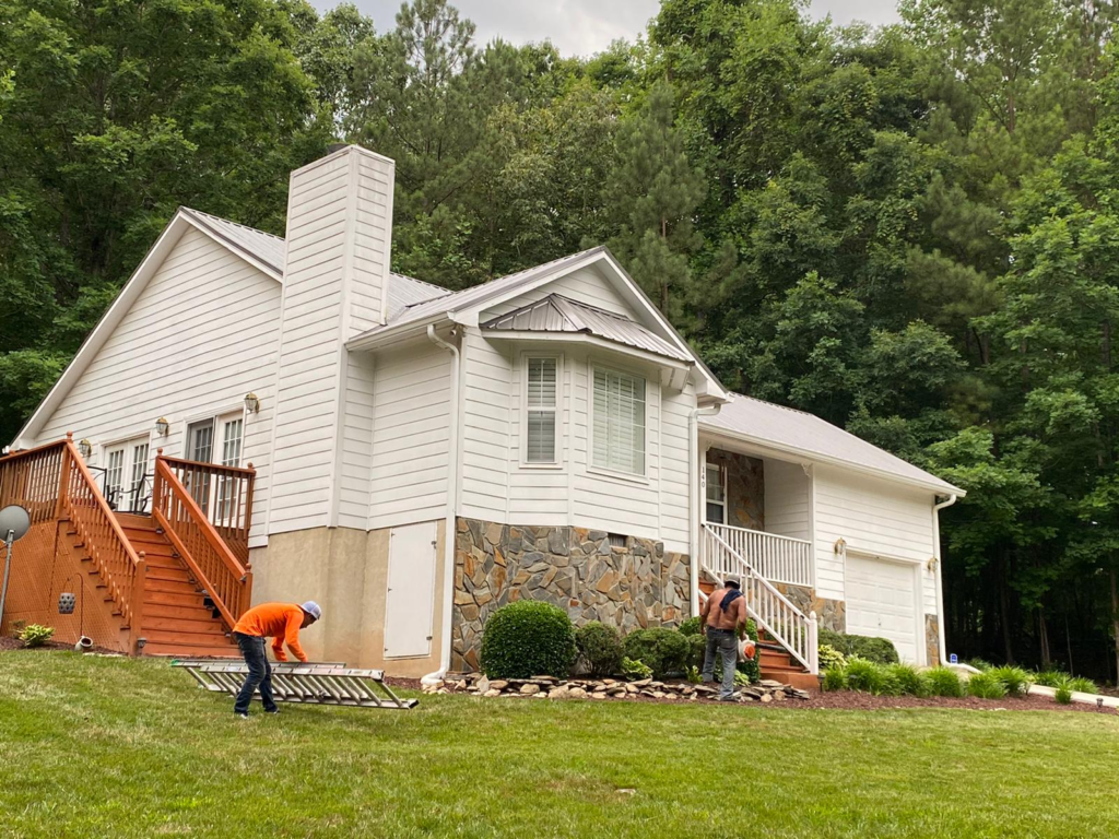 A Home with Light-colored Sidings, Façade, and Metal Roofing